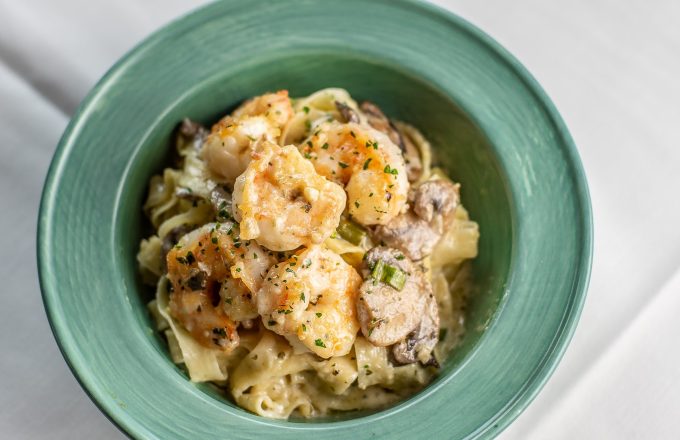 Seafood risotto in green bowl at Carrabba's on Kirby