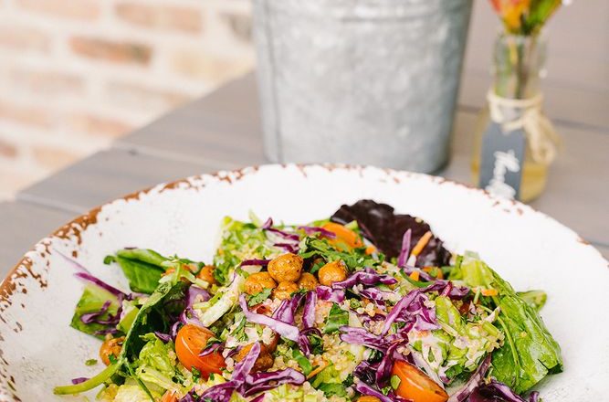 Crispy tahini salad with fresh greens and vegetables in a bowl at Craft Pita — Fountain View