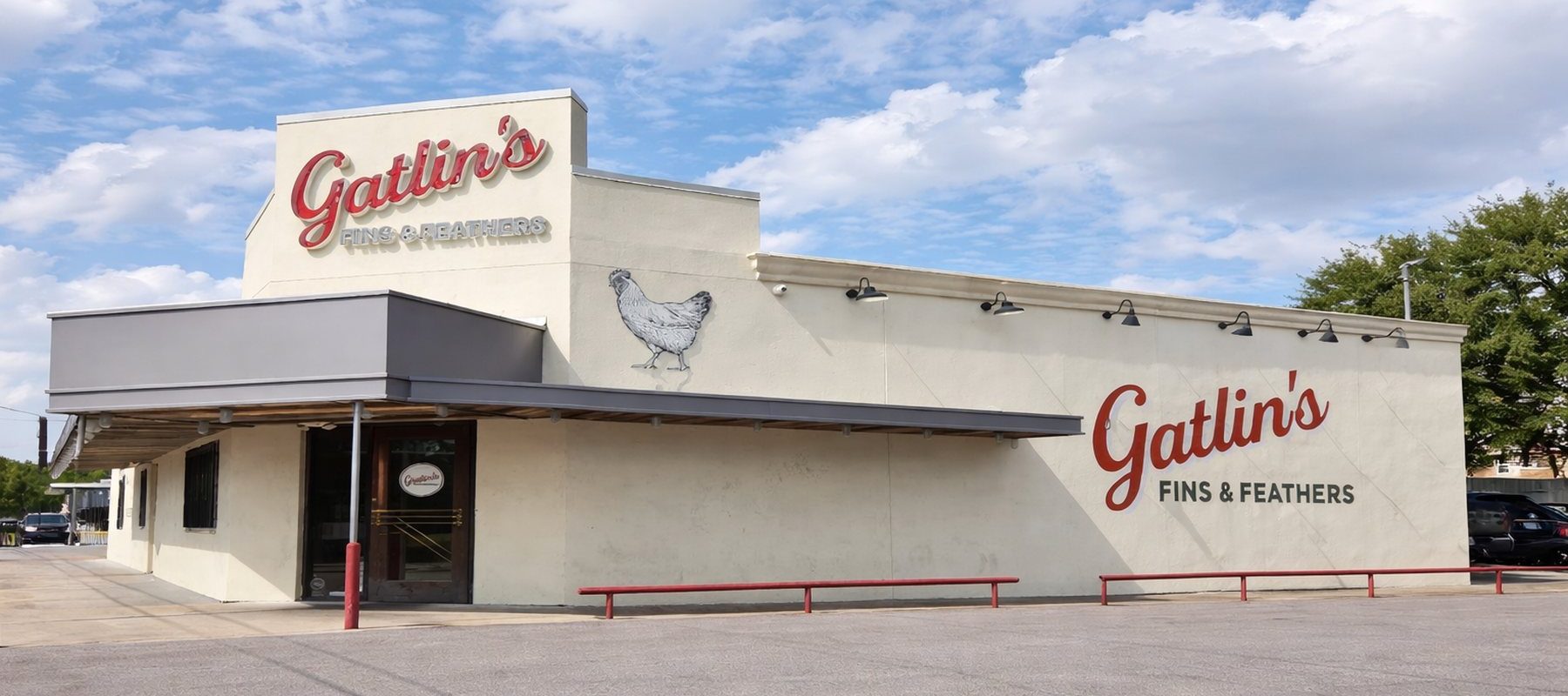 Exterior of Gatlin's Fins and Feathers with chicken logo mural and red signage on Crosstimbers Street in Houston