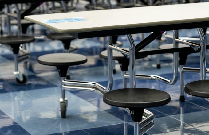 Open seating, first-come first-served. The stools swing out on casters, the floor is polished to a reflective sheen, and the only maître d' is a lunch monitor with a whistle. Reservations are neither required nor acknowledged.